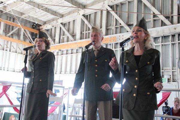 Vocal trio the JACs, from left, Charrie Cobler, Alan Sauer and Jan Gill, perform at the Veteran’s Day event. (Photo by: Kevin N. Hume)